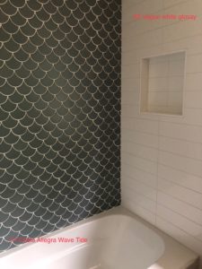 tan glass tile with scalloped shape used for shower accent wall