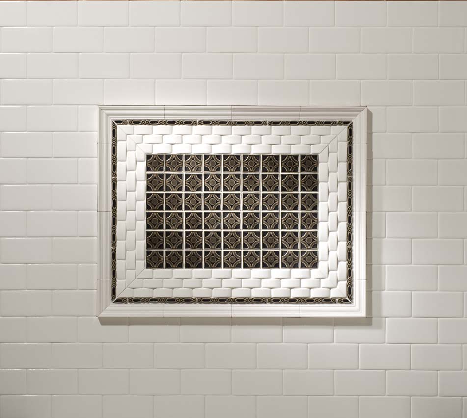 white wall tile with decorative tile inset
