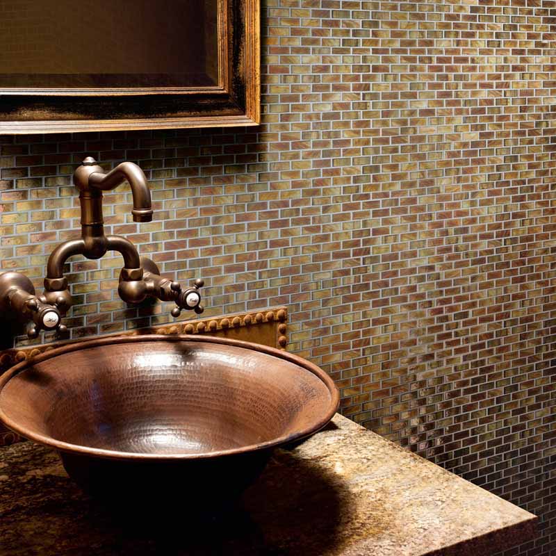copper sink and copper colored wall tiles