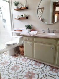 bathroom with flower patterned floor tiles