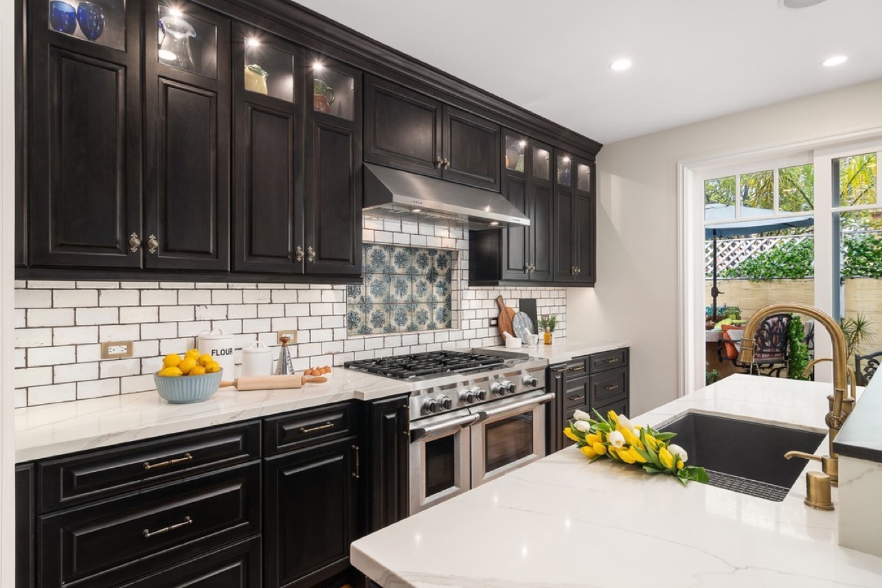 Dramatic black cabinets and classic subway tile