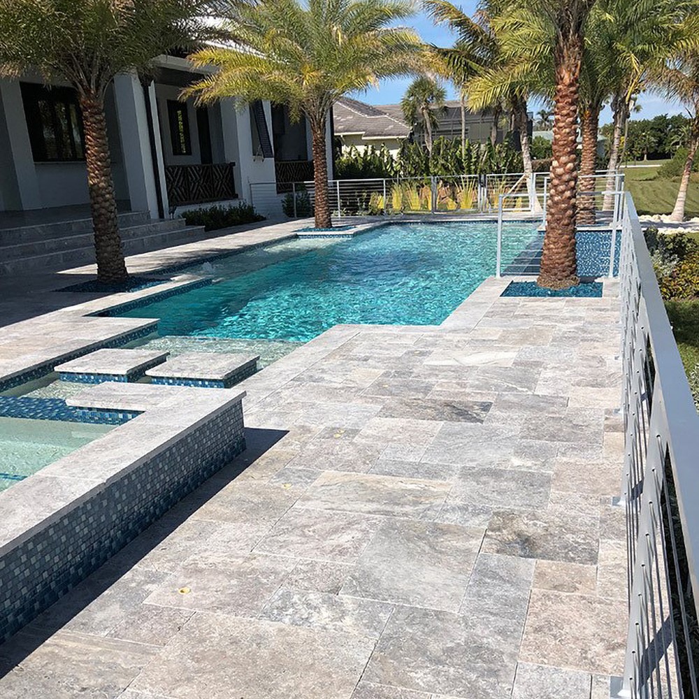 beautiful outdoor tiled patio and pool